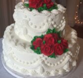 White two-tiered wedding cake with red roses Olde Square Inn Mount Joy PA